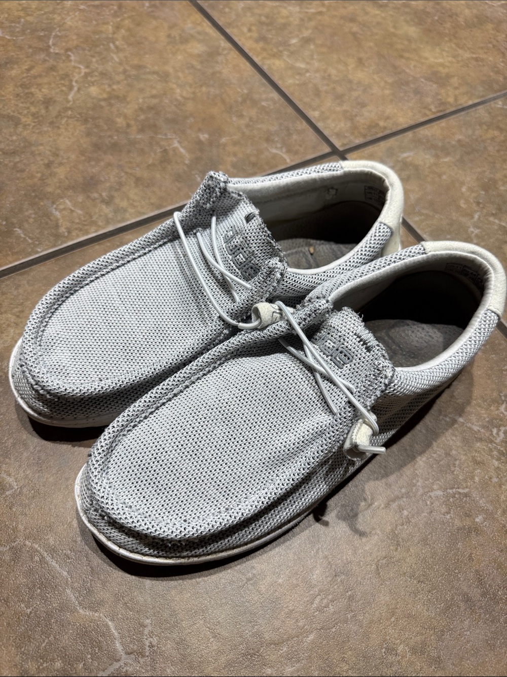 Casual Mesh Men's Slip-On Shoes white in color